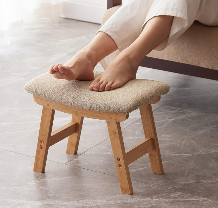 Small under-desk foot rest stool with bamboo stand and soft fabric surface, extra casual seating for living room, bedroom and kitchen